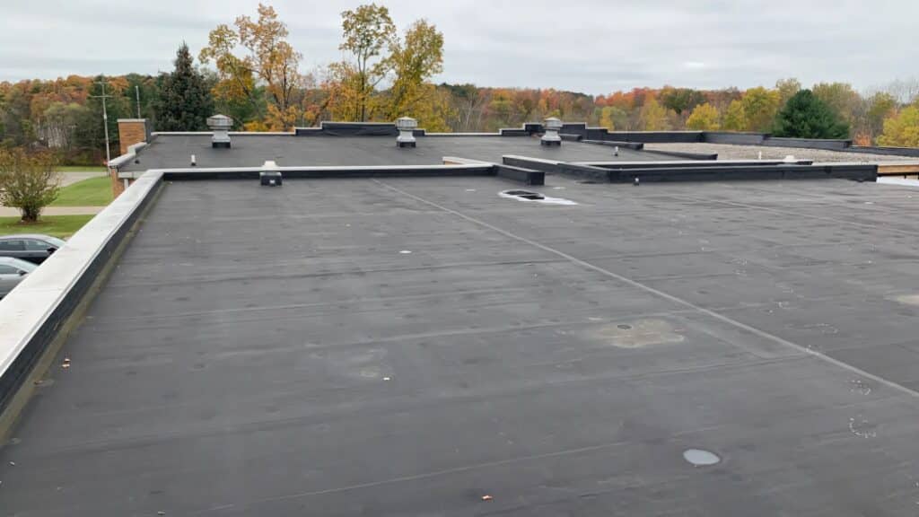 Preventive vs. Reactive Commercial Roof Maintenance EPDM Commercial Roof Overview Cherry Town Commercial Roofing Michigan